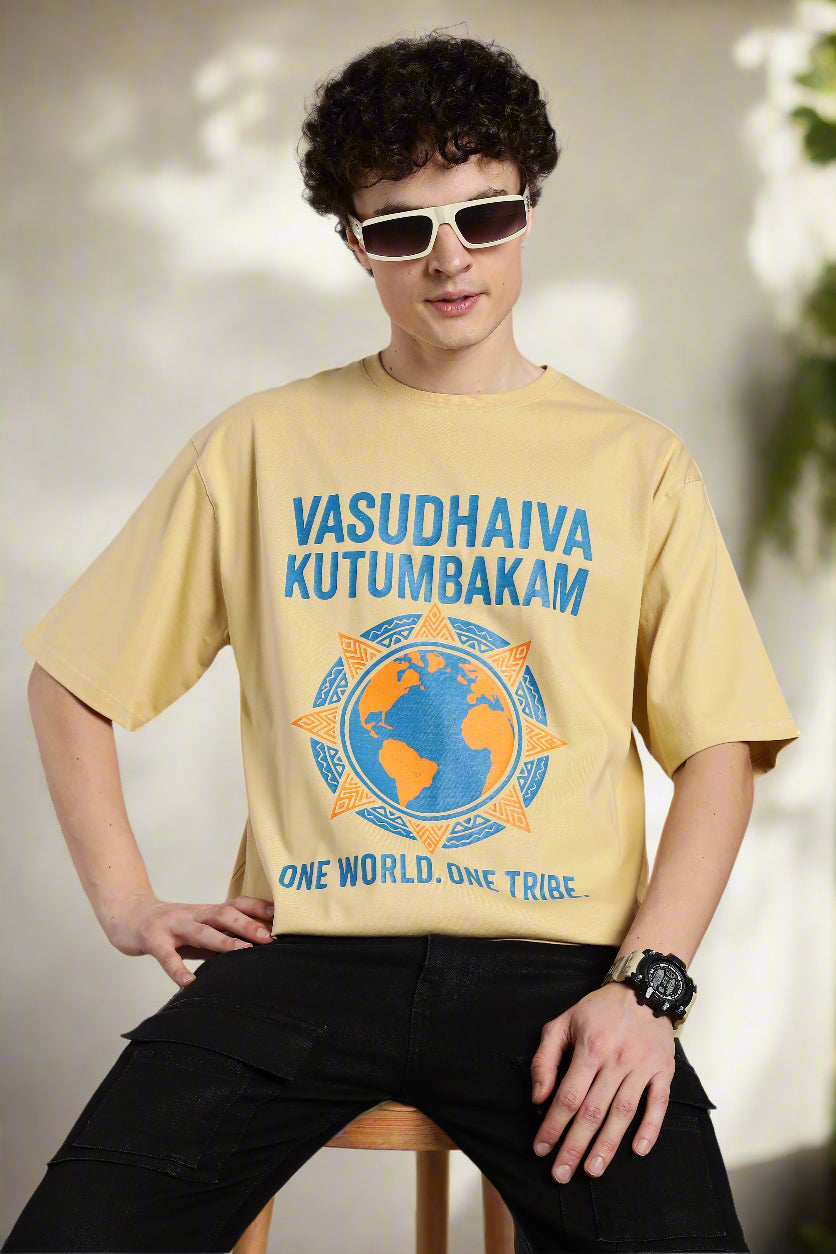 Beige Vasudhaiva Kutumbakam T-shirt with ‘One World. One Tribe’ print, inspired by Indian philosophy and global unity.