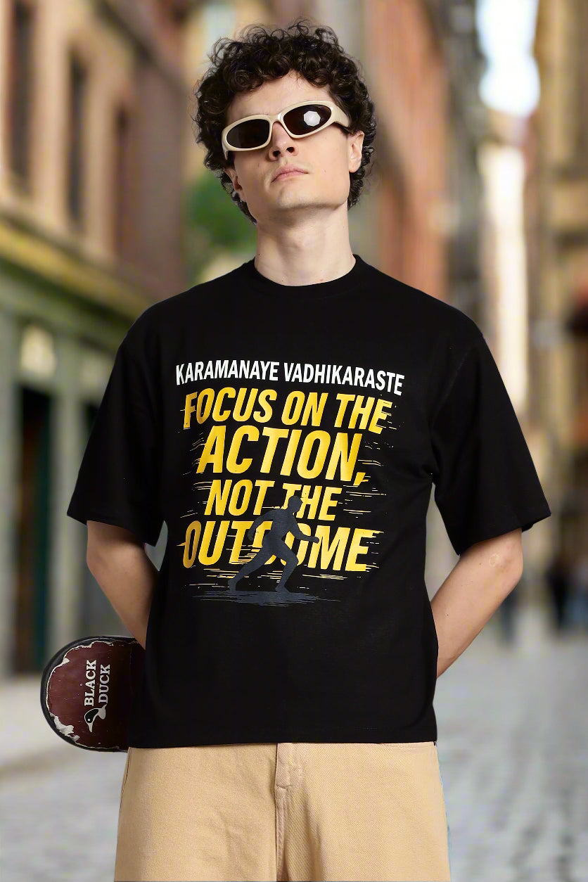 Black T-shirt with ‘Karmanye Vadhikaraste’ Bhagavad Gita quote, Focus on the Action Not the Outcome design, Indian spiritual streetwear in oversized fit