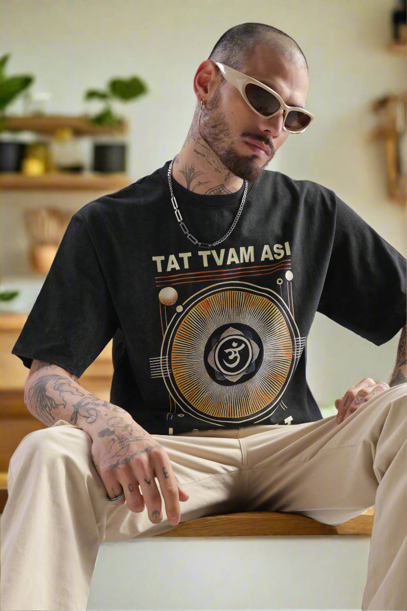 Acid wash black Tat Tvam Asi T-shirt featuring Upanishadic quote and mandala graphic, modern Indian spiritual streetwear.