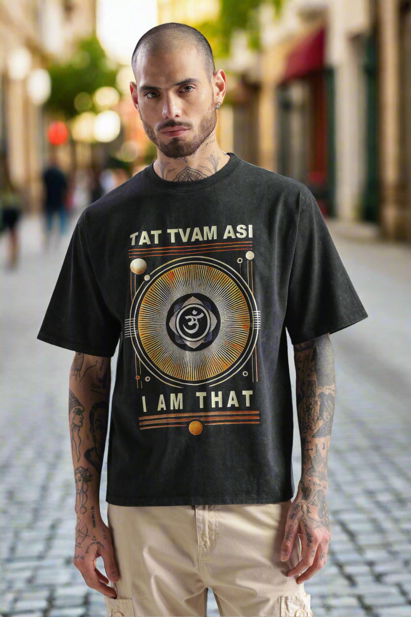 Acid wash black Tat Tvam Asi T-shirt featuring Upanishadic quote and mandala graphic, modern Indian spiritual streetwear.