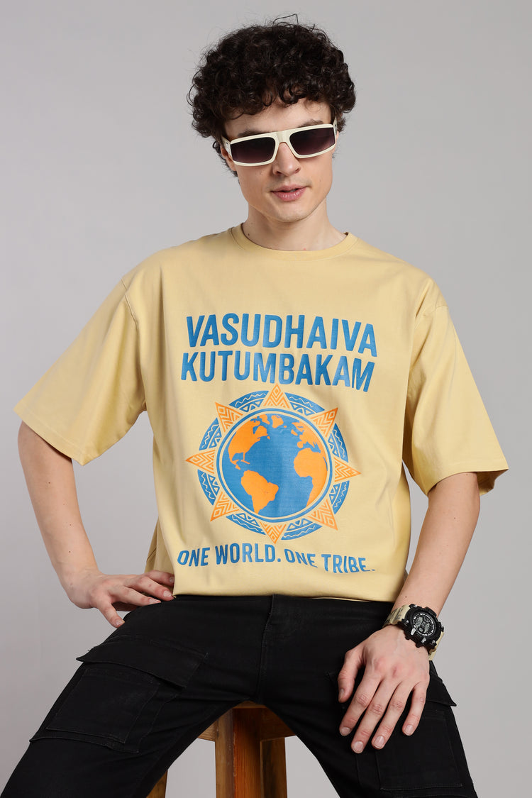Beige Vasudhaiva Kutumbakam T-shirt with ‘One World. One Tribe’ print, inspired by Indian philosophy and global unity.