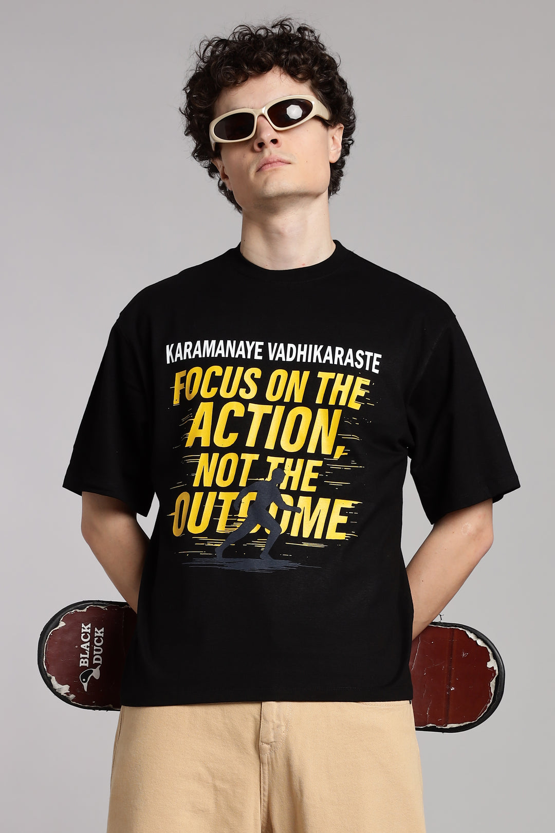 Black T-shirt with ‘Karmanye Vadhikaraste’ Bhagavad Gita quote, Focus on the Action Not the Outcome design, Indian spiritual streetwear in oversized fit